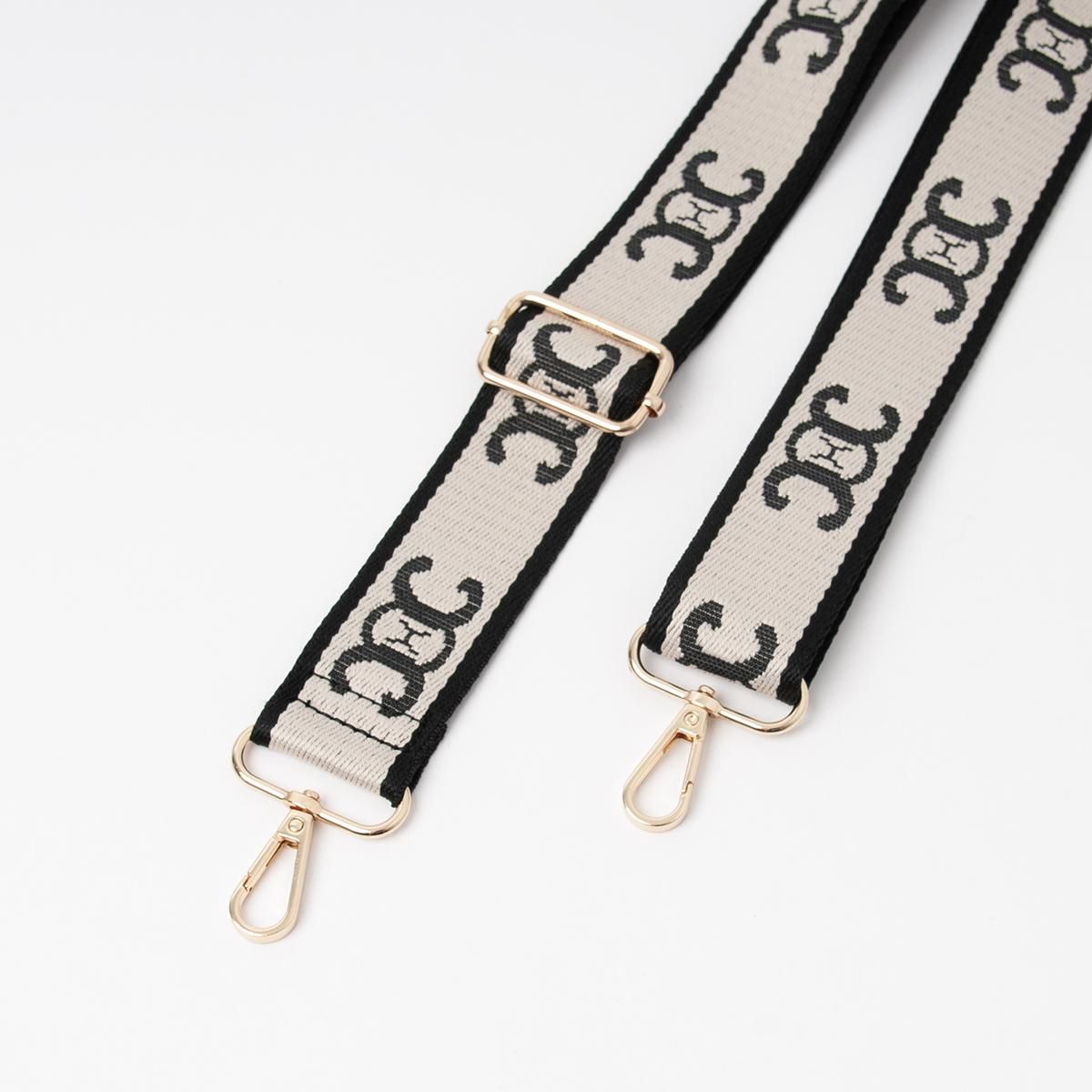 Skulderrem beige og svart - veskereim med mønster og gullfarget metall