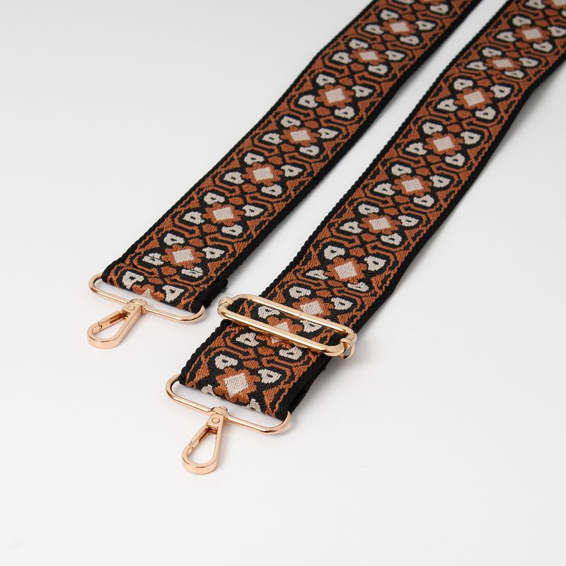 Skulderrem med blomstermønster - svart/cognac